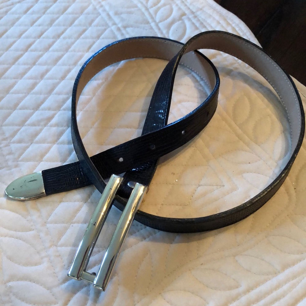 B. B. Simon leather belt with long silver tone metal buckle-tip (made in Spain).